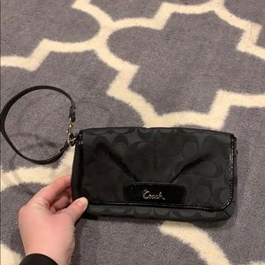 Black and silver Coach wristlet